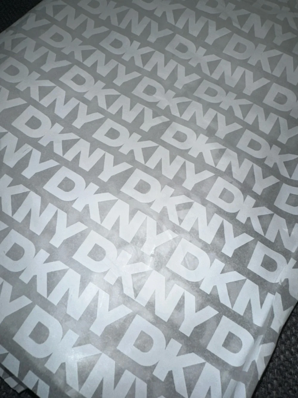 DKNY White Logo Pattern on Gray Tissue Wrap